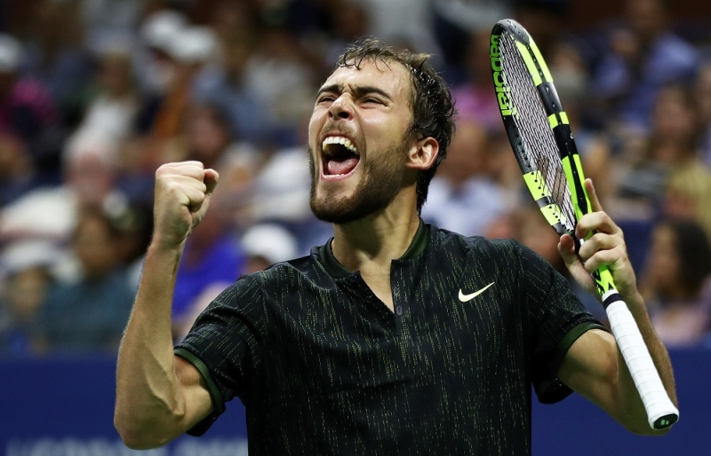 NEW YORK, NY - AUGUST 29:  Jerzy Janowicz of Poland celebrates after winning the second set against Novak Djokovic of Serbia & Montenegro during his first round Men's Singles match on Day One of the 2016 US Open at the USTA Billie Jean King National Tennis Center on August 29, 2016 in the Flushing neighborhood of the Queens borough of New York City.  (Photo by Elsa/Getty Images)
