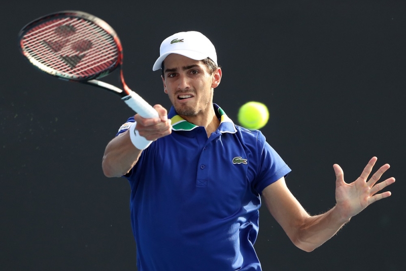 MELBOURNE, AUSTRALIA - JANUARY 16:  Pierre-Hugues Herbert of France plays a forehand in his first round match against Jack Sock of the United States on day one of the 2017 Australian Open at Melbourne Park on January 16, 2017 in Melbourne, Australia.  (Photo by Scott Barbour/Getty Images)